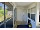 Enclosed porch with multiple screened windows providing natural light and ventilation at 5050 Prosch Cir, North Port, FL 34288