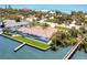 Beautiful waterfront property with lush greenery, private dock, and serene water views, located near the beach at 8115 Manasota Key Rd, Englewood, FL 34223
