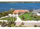 Waterfront home with lush landscaping, private dock, screened pool, and views of the intercoastal waterway at 8115 Manasota Key Rd, Englewood, FL 34223