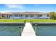 Spacious waterfront home with beautiful lawn, private dock, and serene water views at 8115 Manasota Key Rd, Englewood, FL 34223