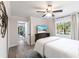 Comfortable bedroom with en suite bathroom, featuring an ocean view TV at 8115 Manasota Key Rd, Englewood, FL 34223