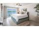 This bedroom features a waterfront view and ceiling fan at 8115 Manasota Key Rd, Englewood, FL 34223