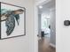 A hallway leads to a serene bedroom with a water view, promising restful nights at 8115 Manasota Key Rd, Englewood, FL 34223