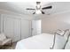Light bedroom features closet space, a ceiling fan and a calming neutral palette at 8115 Manasota Key Rd, Englewood, FL 34223
