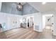 Elegant entryway with decorative glass door, high ceilings, and a stylish console table with a mirror at 8115 Manasota Key Rd, Englewood, FL 34223