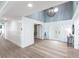 Well-lit foyer with high ceilings, a chandelier, and stylish wainscoting at 8115 Manasota Key Rd, Englewood, FL 34223