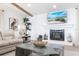 Inviting living room features a decorative fireplace, natural wood accents, and elegant decor at 8115 Manasota Key Rd, Englewood, FL 34223