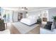 Large primary bedroom with an open design featuring walk-in closet, ensuite, and large sliding glass door at 8115 Manasota Key Rd, Englewood, FL 34223