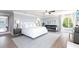 An expansive main bedroom provides luxurious comfort and style with abundant natural light at 8115 Manasota Key Rd, Englewood, FL 34223
