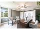 Home office featuring a dark wood desk, crown molding, and plush seating at 8115 Manasota Key Rd, Englewood, FL 34223