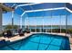 Inviting screened-in pool area with comfortable seating and picturesque waterfront views, ideal for outdoor relaxation and enjoyment at 8115 Manasota Key Rd, Englewood, FL 34223
