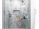 This stunning shower has elegant tile, matte black hardware, and glass doors at 8115 Manasota Key Rd, Englewood, FL 34223