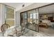 Balcony featuring a glass table with wicker chairs and beautiful views at 851 Bayway Blvd # 403, Clearwater Beach, FL 33767