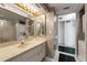 Bathroom includes a large mirror, vanity, and walk-in shower at 851 Bayway Blvd # 403, Clearwater Beach, FL 33767
