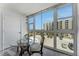 Bright breakfast nook with expansive windows, perfect for enjoying morning coffee and scenic views of the surrounding neighborhood at 851 Bayway Blvd # 403, Clearwater Beach, FL 33767