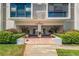 Elegant condo building entrance with tasteful landscaping, creating a welcoming and sophisticated arrival experience at 851 Bayway Blvd # 403, Clearwater Beach, FL 33767