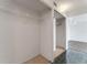 Walk-in closet featuring custom shelving and carpeted floor at 851 Bayway Blvd # 403, Clearwater Beach, FL 33767