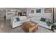 Welcoming living room with comfortable seating, accent pillows, and a view into the kitchen at 851 Bayway Blvd # 403, Clearwater Beach, FL 33767
