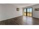 Spacious living room with sliding doors to balcony at 851 Bayway Blvd # 403, Clearwater Beach, FL 33767