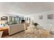 Inviting living room with comfortable seating and natural light from the glass balcony doors at 851 Bayway Blvd # 403, Clearwater Beach, FL 33767