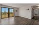 Living room with sliding glass doors leading to a balcony with a scenic view at 851 Bayway Blvd # 403, Clearwater Beach, FL 33767