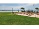 Relaxing patio area by the water with picnic tables and beach access at 851 Bayway Blvd # 403, Clearwater Beach, FL 33767