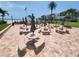 A community patio offers shaded picnic tables and barbecue grills near the beach at 851 Bayway Blvd # 403, Clearwater Beach, FL 33767