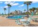 Community pool and deck with outdoor seating, ideal for relaxation and socializing at 851 Bayway Blvd # 403, Clearwater Beach, FL 33767