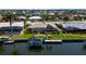 Rear exterior of home with enclosed lanai, boat dock, and waterfront views at 925 Don Juan Ct, Punta Gorda, FL 33950