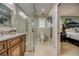 Bright bathroom features a glass shower, granite vanity, and neutral tiling at 925 Don Juan Ct, Punta Gorda, FL 33950