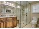 Updated bathroom features a glass walk-in shower, a comfortable stool and modern vanity at 925 Don Juan Ct, Punta Gorda, FL 33950