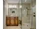 Modern bathroom with glass-enclosed shower, updated vanity, and neutral tile at 925 Don Juan Ct, Punta Gorda, FL 33950