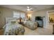 Guest bedroom with two beds, overhead fan and neutral colored walls at 925 Don Juan Ct, Punta Gorda, FL 33950