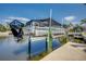 Modern boat lift system for easy and secure boat storage, providing convenient access to the waterways at 925 Don Juan Ct, Punta Gorda, FL 33950