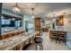 Spacious kitchen featuring stainless steel appliances, granite countertops, custom cabinetry and lighting at 925 Don Juan Ct, Punta Gorda, FL 33950