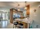 Kitchen bar with granite countertop, stainless steel appliances, and nearby front door at 925 Don Juan Ct, Punta Gorda, FL 33950