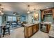 Open kitchen area connecting to the living room featuring a bar, wine rack, and drink fridge at 925 Don Juan Ct, Punta Gorda, FL 33950