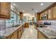 Spacious kitchen featuring granite countertops, tile backsplash, and stainless steel appliances at 925 Don Juan Ct, Punta Gorda, FL 33950