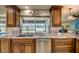 Kitchen sink looking out to the pool area with outdoor seating at 925 Don Juan Ct, Punta Gorda, FL 33950