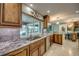 Kitchen view featuring a large window, granite countertops, and stainless steel appliances at 925 Don Juan Ct, Punta Gorda, FL 33950