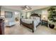 Elegant main bedroom features a large bed, ceiling fan, and access to the en-suite bath at 925 Don Juan Ct, Punta Gorda, FL 33950