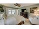 Airy primary bedroom includes lanai access, a dark wood dresser, and soft, natural lighting at 925 Don Juan Ct, Punta Gorda, FL 33950