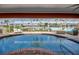 Inviting screened-in pool with brick surround and comfortable seating, perfect for relaxing and enjoying waterfront views at 925 Don Juan Ct, Punta Gorda, FL 33950