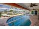 Beautiful screened-in pool area with lounge chairs and waterfront views, creating a tranquil outdoor oasis at 925 Don Juan Ct, Punta Gorda, FL 33950