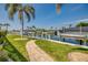 Landscaped walkway leading to a private boat dock, offering direct access to the waterways and waterfront living at 925 Don Juan Ct, Punta Gorda, FL 33950