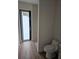 Modern powder room adjacent to an exterior entrance at 10522 Riverside Rd, Port Charlotte, FL 33981
