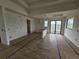Expansive living room awaiting personalization, with wood-style floors and abundant natural light at 10522 Riverside Rd, Port Charlotte, FL 33981