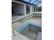 Backyard pool under construction with blue tile at 10522 Riverside Rd, Port Charlotte, FL 33981