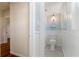 A powder room with black and white tile floor and blue wainscotting at 110 Gilchrist St, Punta Gorda, FL 33950