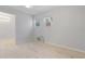 Bedroom featuring wood-look tile floors, light gray walls, and a window with an air conditioning unit at 110 Gilchrist St, Punta Gorda, FL 33950